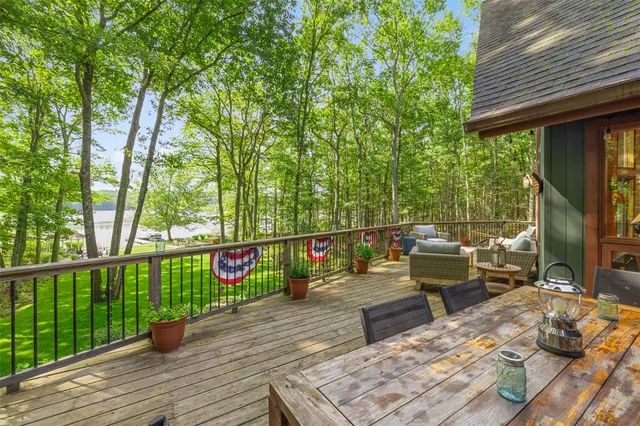 a balcony with furniture and wooden floor