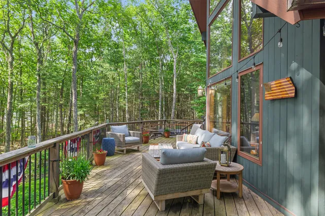 a view of a patio with furniture and wooden floor