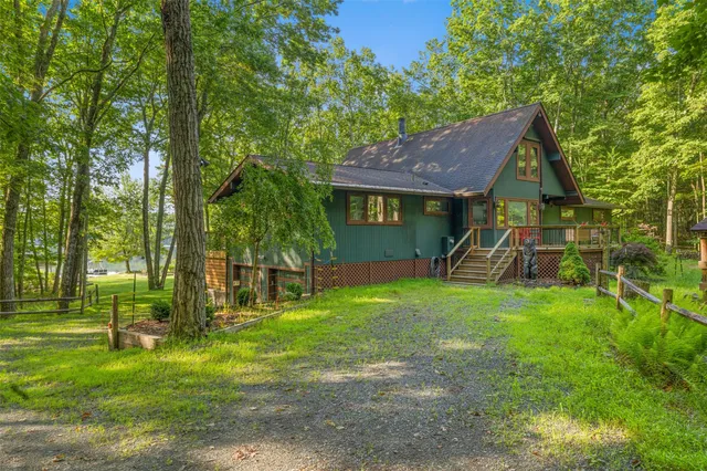 a view of a house with a backyard