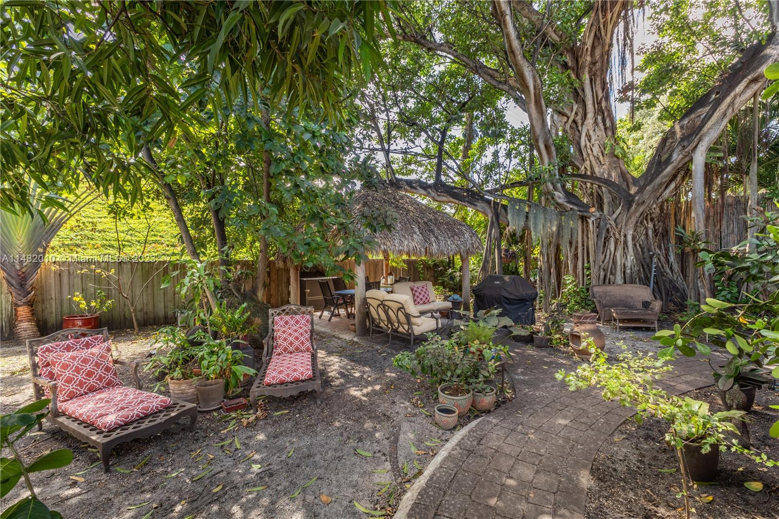 28 Southwest 26th Road Miami, FL 33129 - Photo 26 of 38 a view of a backyard with sitting area and garden