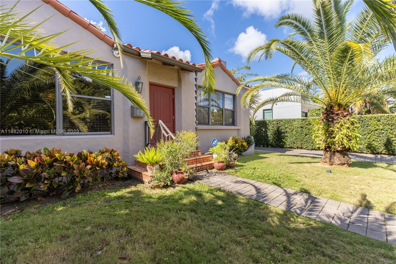 28 Southwest 26th Road Miami, FL 33129 - Photo 36 of 38 a front view of a house with swimming pool having outdoor seating