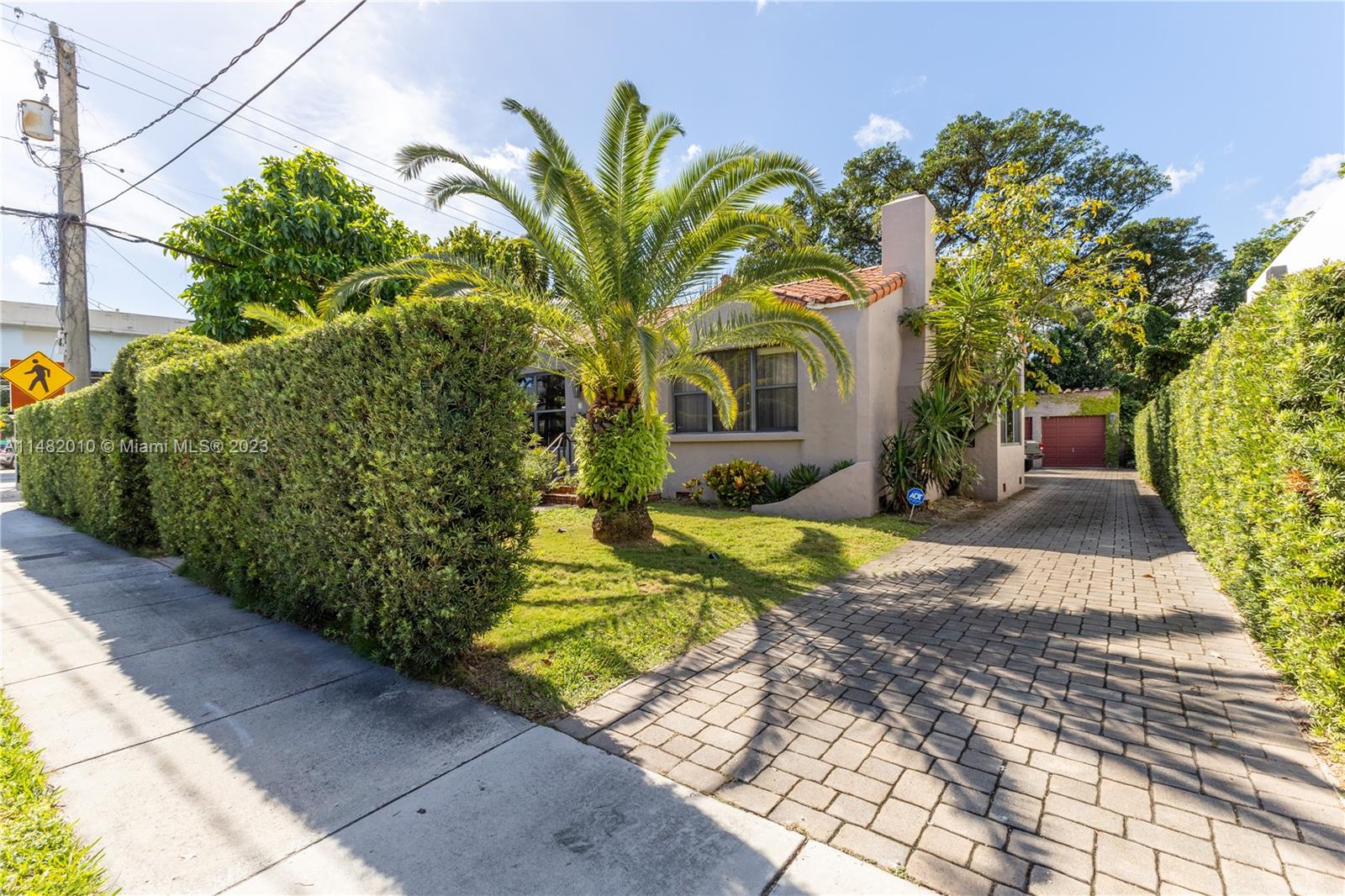 28 Southwest 26th Road Miami, FL 33129 - Photo 38 of 38 a view of a house with a yard and potted plants