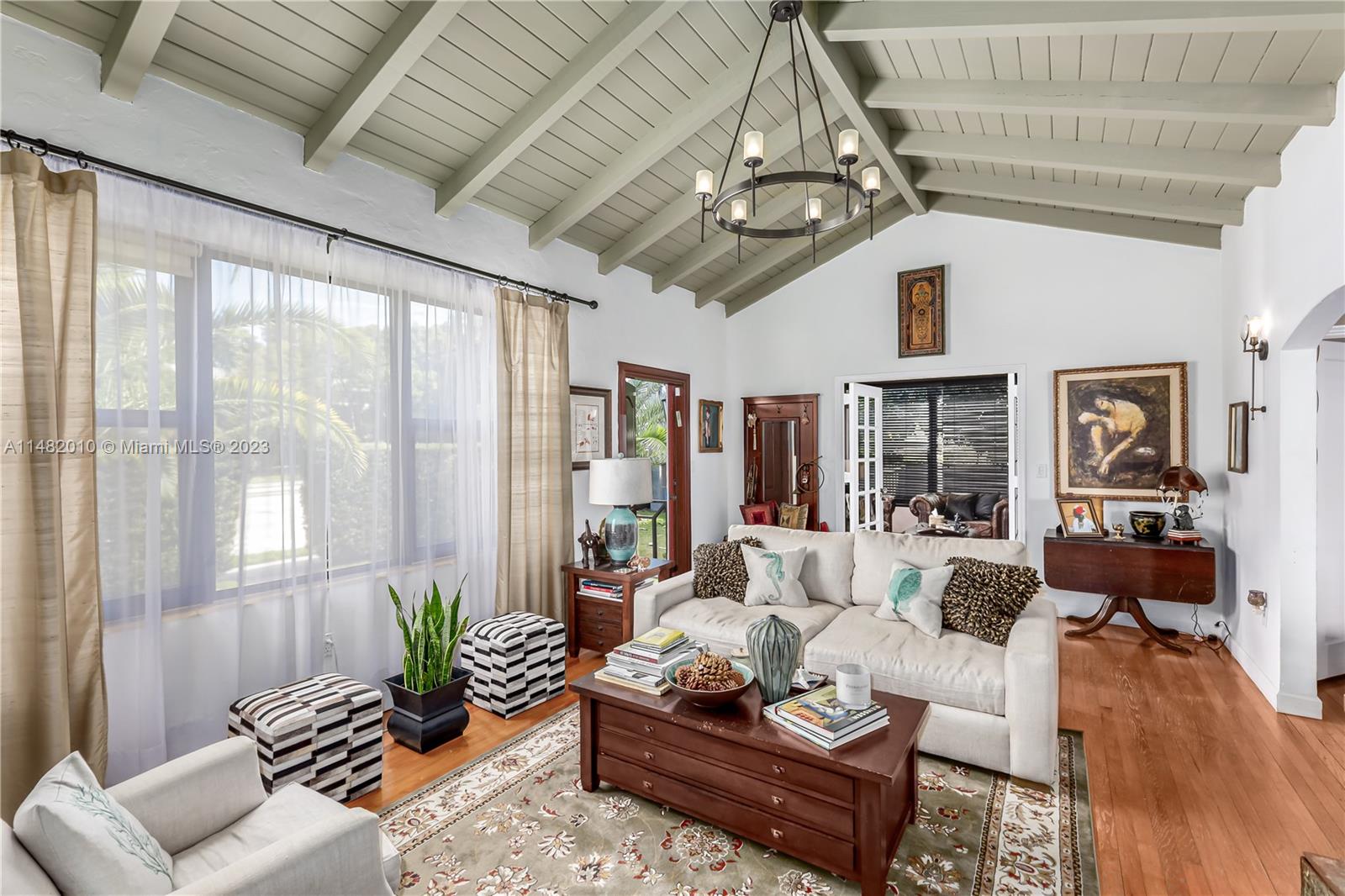 28 Southwest 26th Road Miami, FL 33129 - Photo 7 of 38 a living room with furniture potted plant and a large window