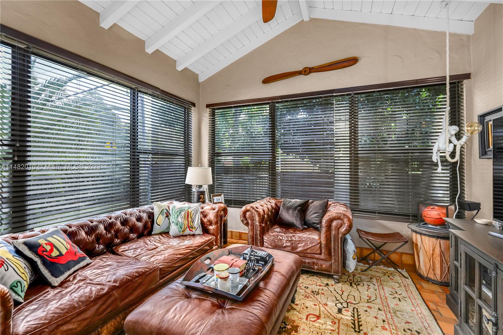 28 Southwest 26th Road Miami, FL 33129 - Photo 9 of 38 a living room with furniture and a floor to ceiling window