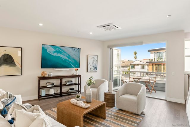 a kitchen with stainless steel appliances granite countertop a stove refrigerator and cabinets