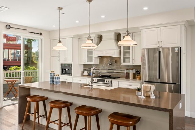 a view of a street with palm trees