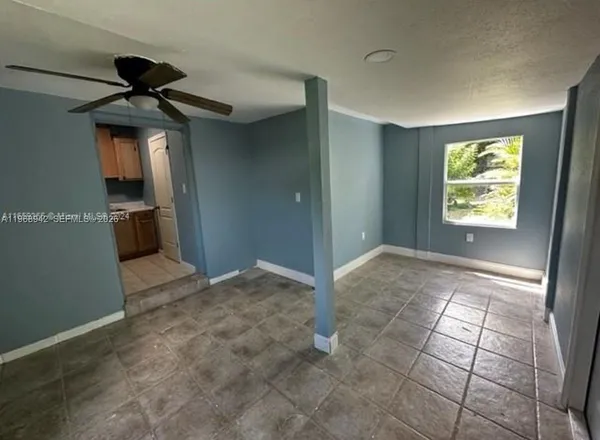 a view of a kitchen with a sink and a window