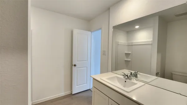 a bathroom with a sink toilet and vanity