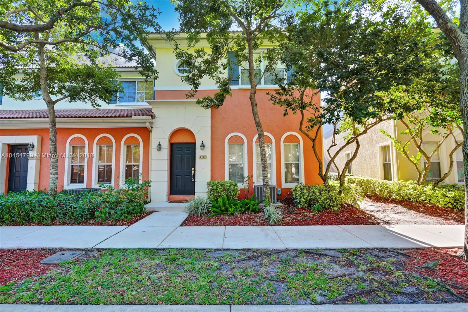 2127 Southwest 99th Way Miramar, FL 33025 - Photo 1 of 43 a front view of house with a garden