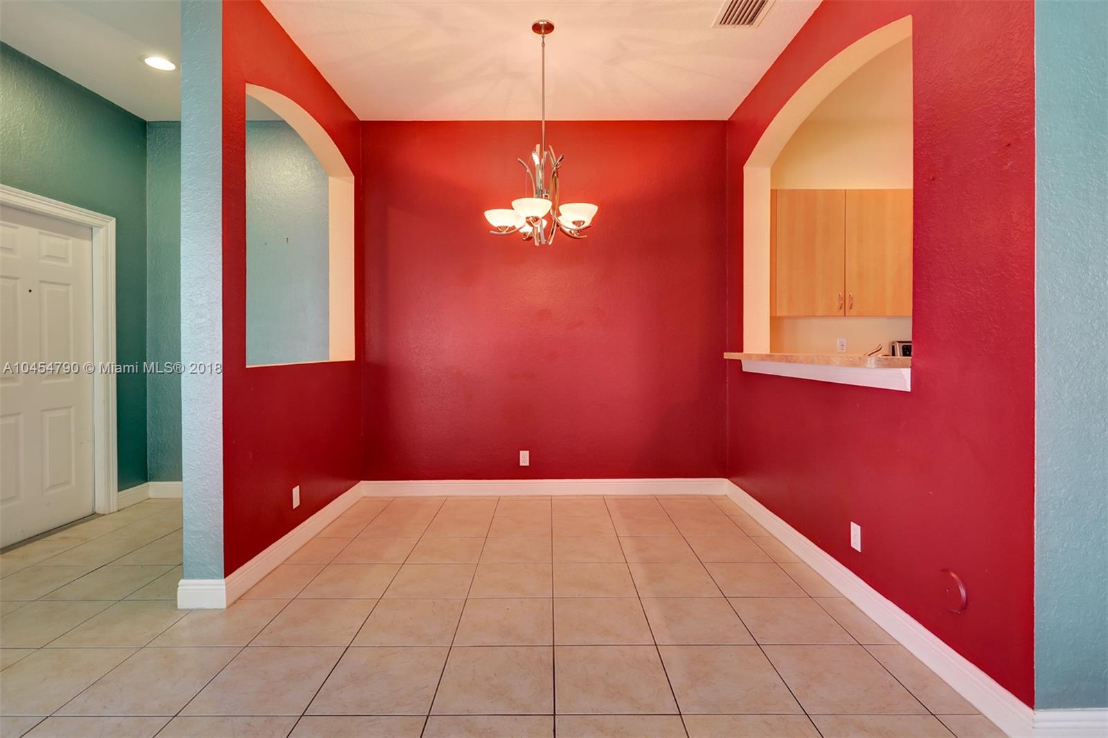2127 Southwest 99th Way Miramar, FL 33025 - Photo 11 of 43 a view of a hallway with a chandelier