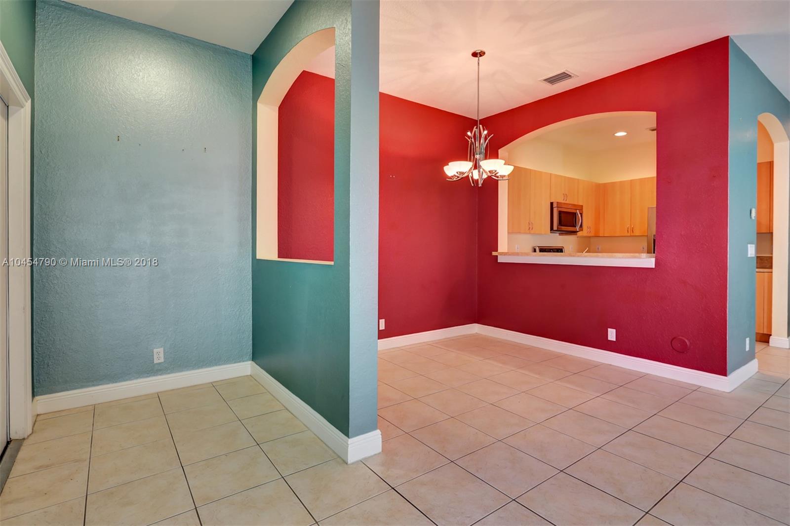 2127 Southwest 99th Way Miramar, FL 33025 - Photo 12 of 43 a view of a livingroom with a workspace
