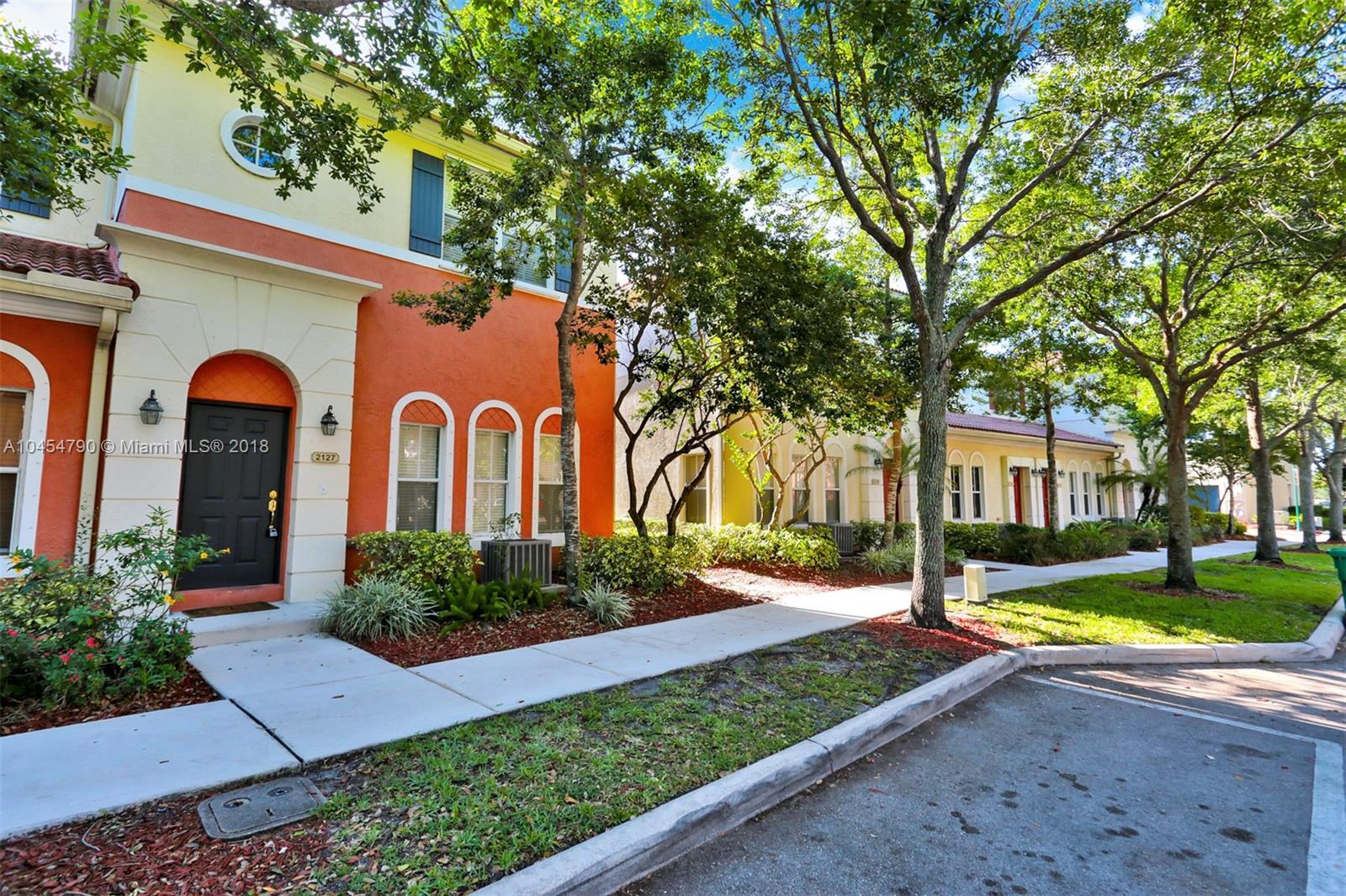 2127 Southwest 99th Way Miramar, FL 33025 - Photo 34 of 43 a front view of a house with garden