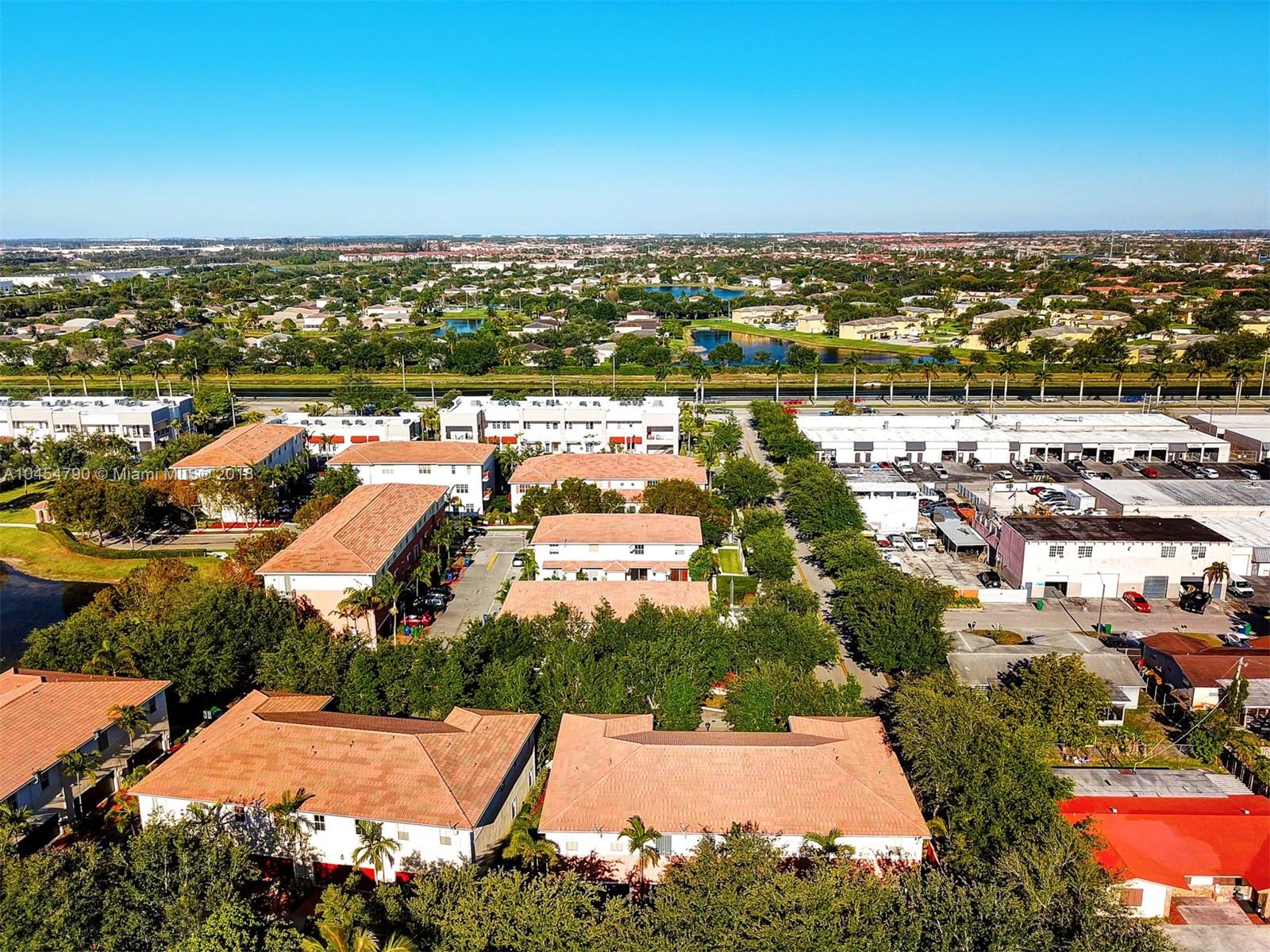 2127 Southwest 99th Way Miramar, FL 33025 - Photo 41 of 43 an aerial view of residential houses with city view
