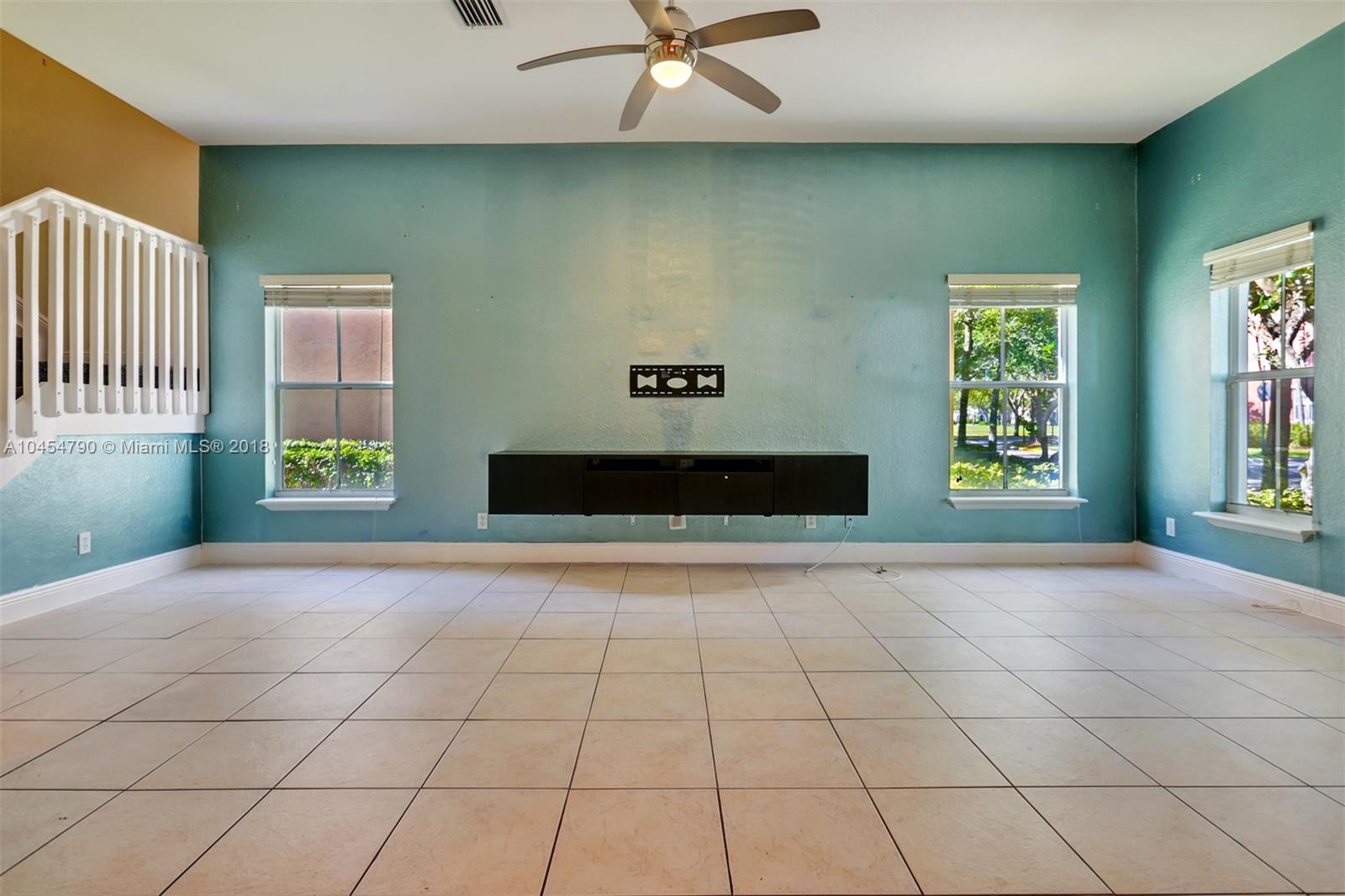 2127 Southwest 99th Way Miramar, FL 33025 - Photo 6 of 43 a view of an empty room with a window