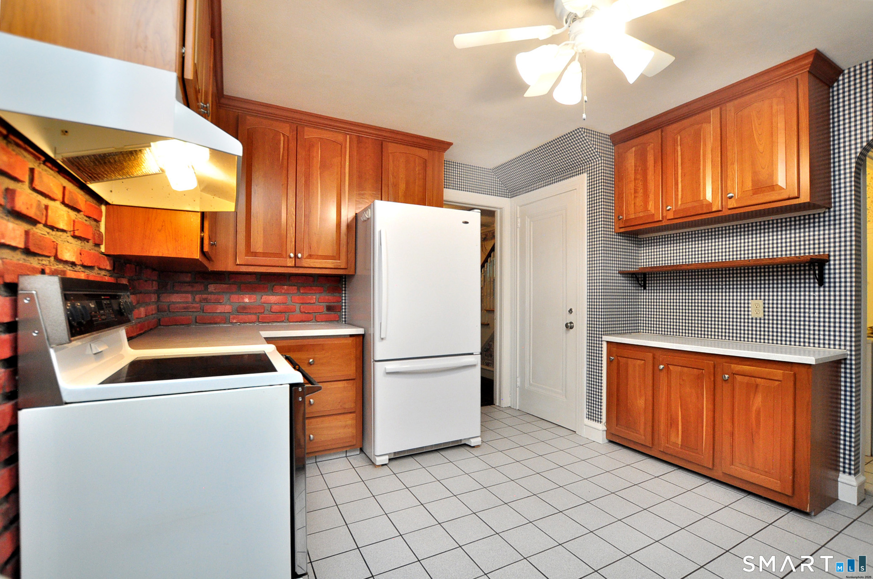 10 Harvey Road Windsor, CT 06095 - Photo 11 of 36 a kitchen with stainless steel appliances granite countertop a refrigerator a sink and a stove