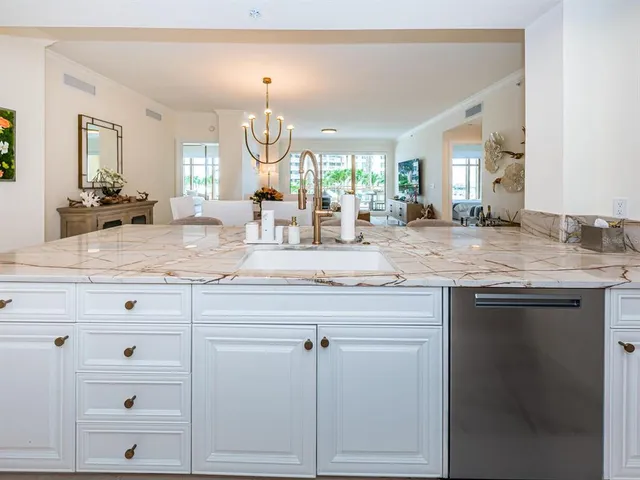 a kitchen with cabinets appliances and a counter space