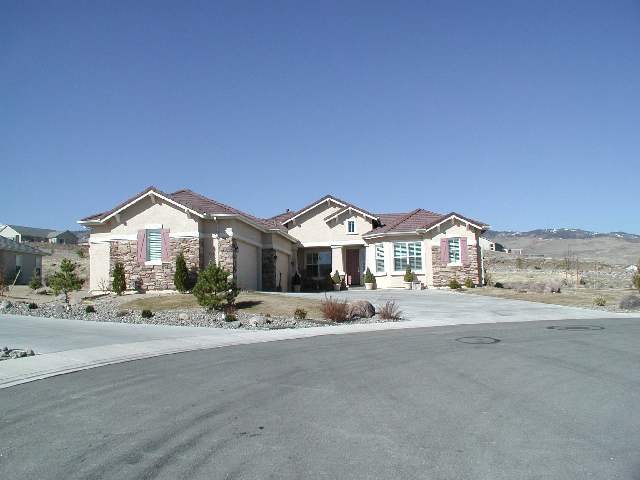 152 Mule Creek Circle Reno, NV 89511 - Photo 1 of 9 a view of a house with a yard and wooden fence