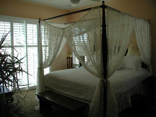 152 Mule Creek Circle Reno, NV 89511 - Photo 6 of 9 a bedroom with a bed and a window