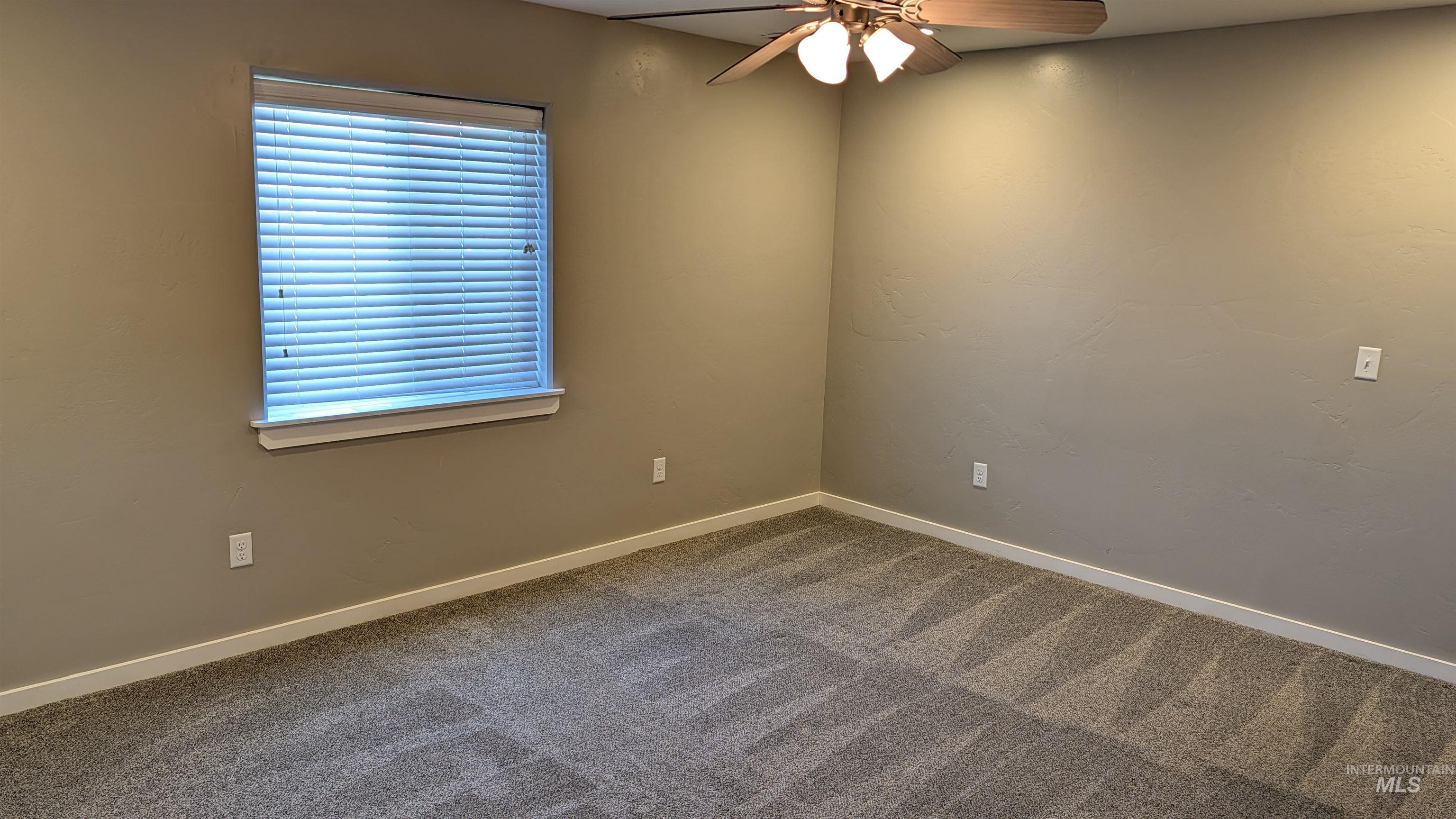 622 Lochsa Loop Heyburn, ID 83336 - Photo 9 of 17 Room featuring neutral-toned walls and patterned carpeting