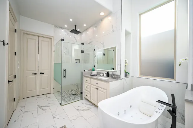 a bathroom with a bathtub and a sink