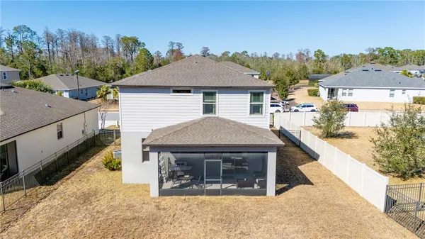 an aerial view of residential houses with outdoor space