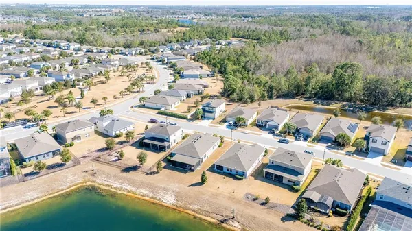a view of a swimming pool with a yard