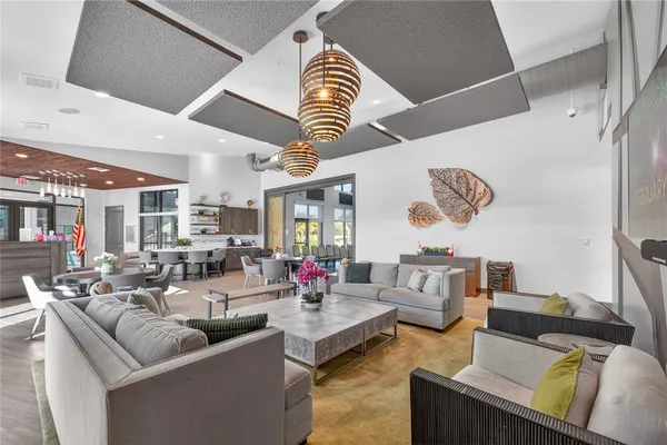 an aerial view of residential houses with outdoor space and trees