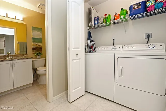 a bathroom with a granite countertop sink a toilet and a mirror