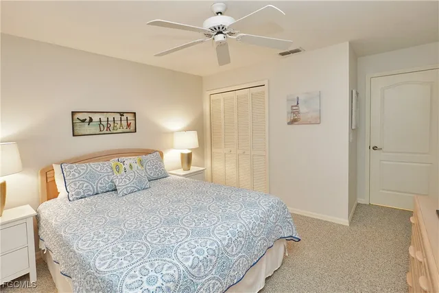 a living room with fireplace furniture and a large window
