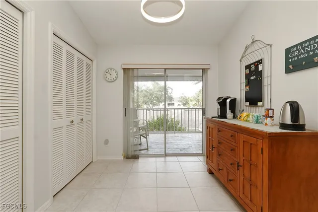 a kitchen with stainless steel appliances white cabinets and a sink