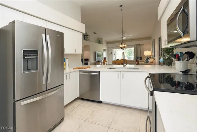 a room with a washing machine and a sink