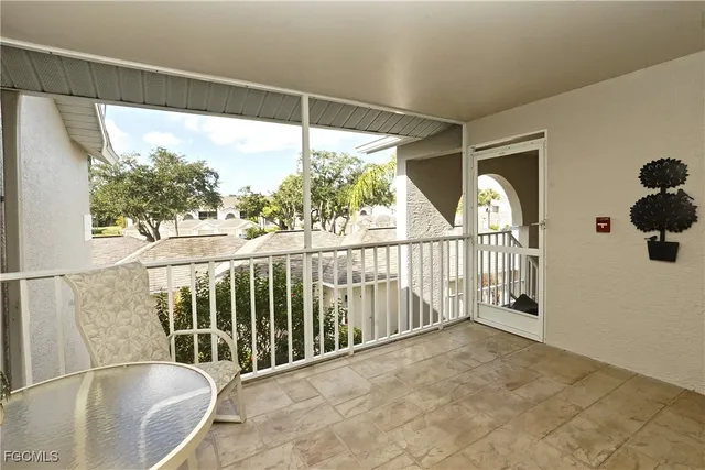 a dining room with wooden floor and a table chair