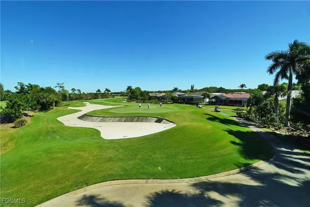 a view of a room with dining table and chairs
