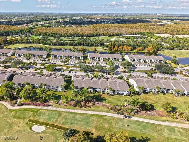 an aerial view of a house with a lot of flower plants