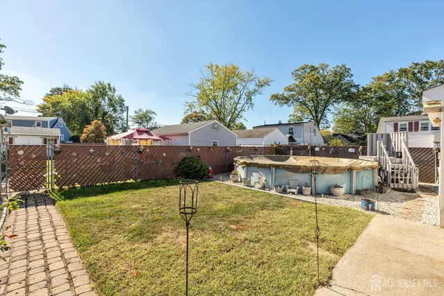 a view of a swimming pool with an outdoor space and seating area