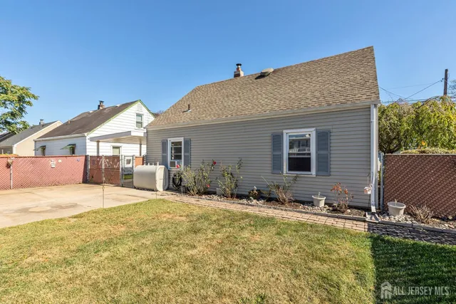 a view of a house with swimming pool and sitting area