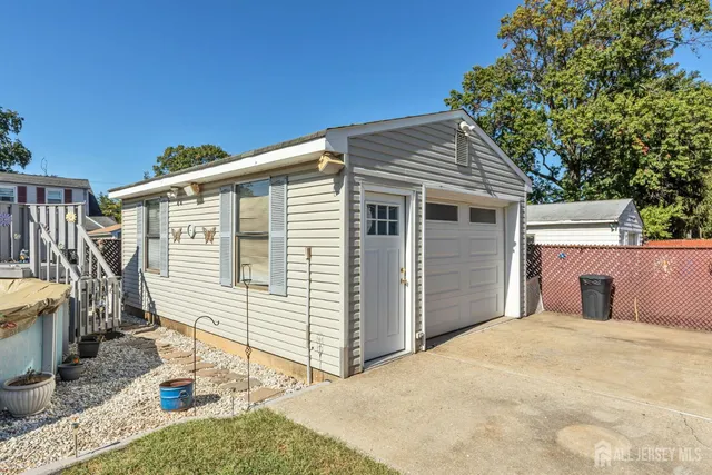 a view of a house with wooden fence
