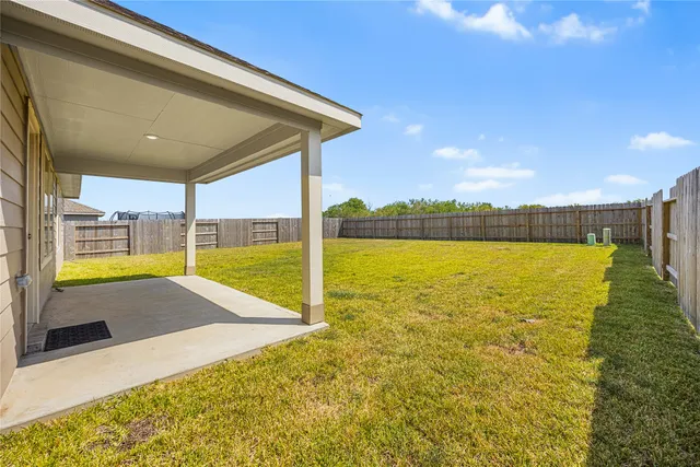 a view of garage and yard