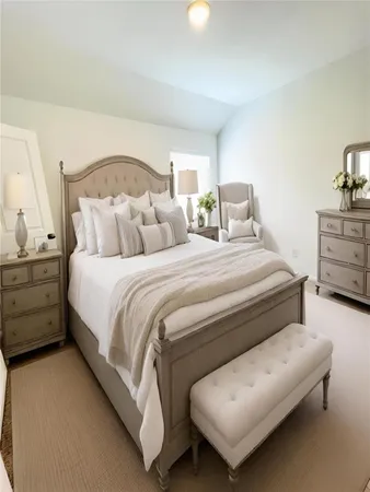 a bedroom with a bed and a couch