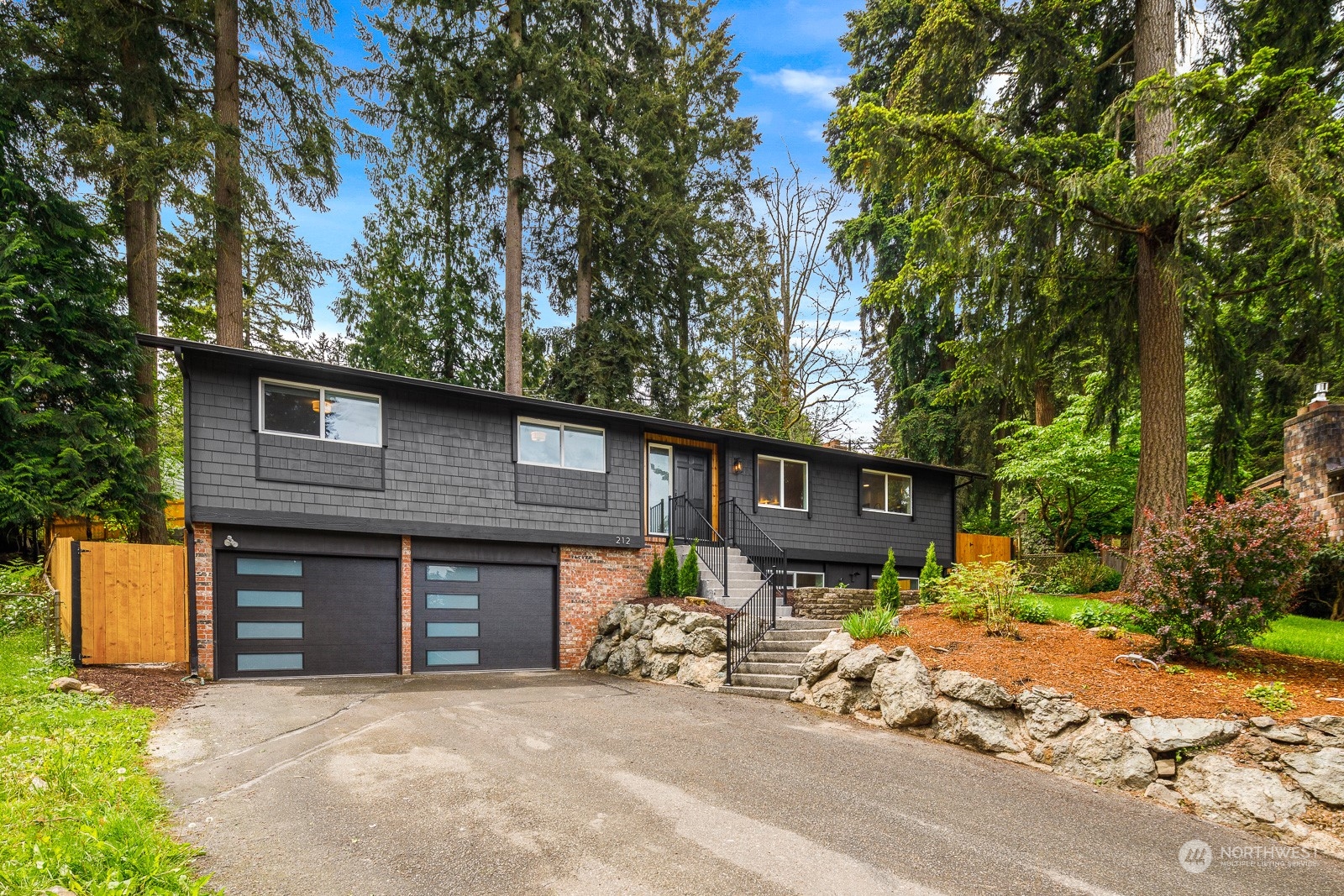 212 143rd Street Southeast Everett, WA 98208 - Photo 1 of 40 a front view of a house with yard and seating area