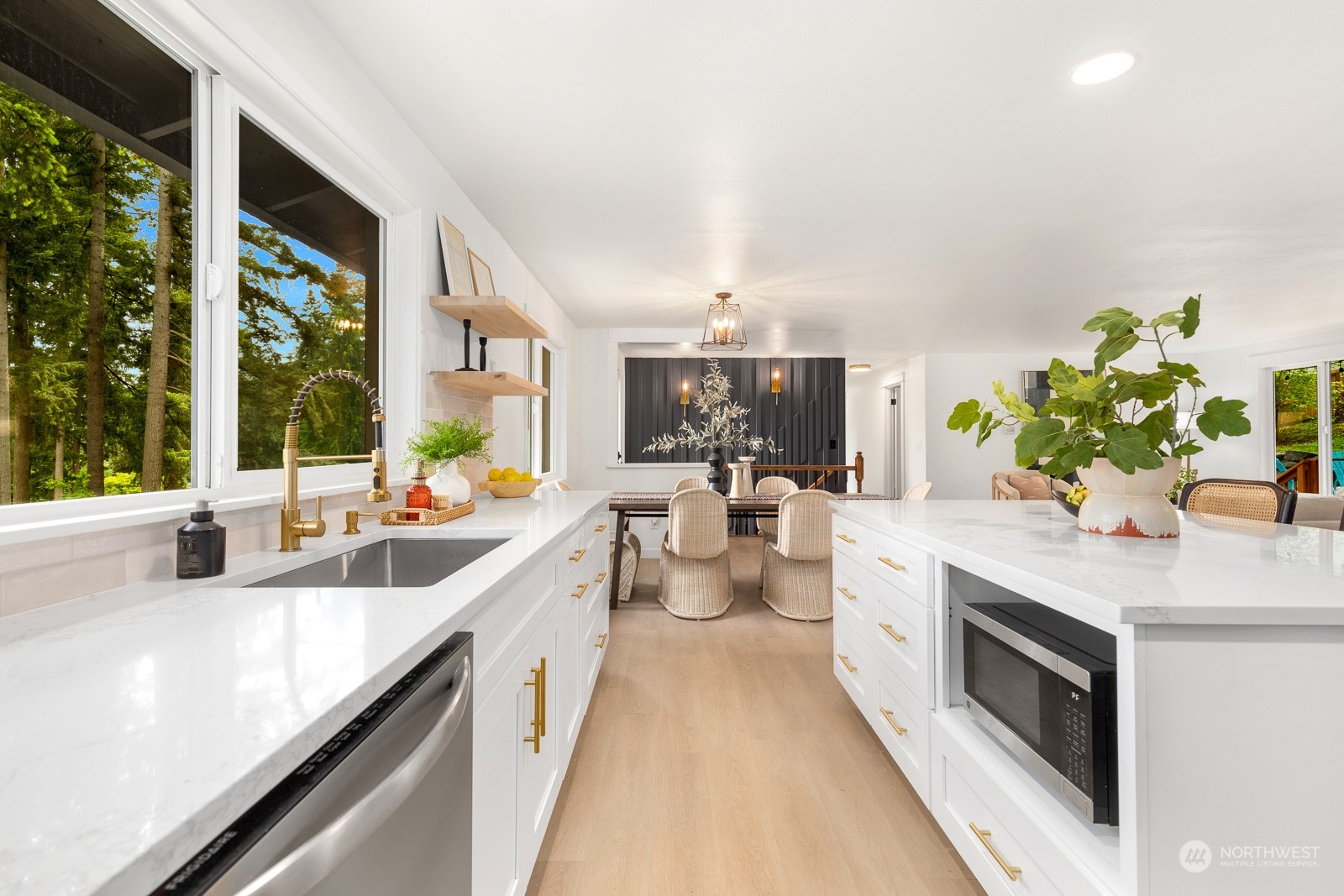 212 143rd Street Southeast Everett, WA 98208 - Photo 11 of 40 a kitchen with stainless steel appliances a sink a counter top space and living room view
