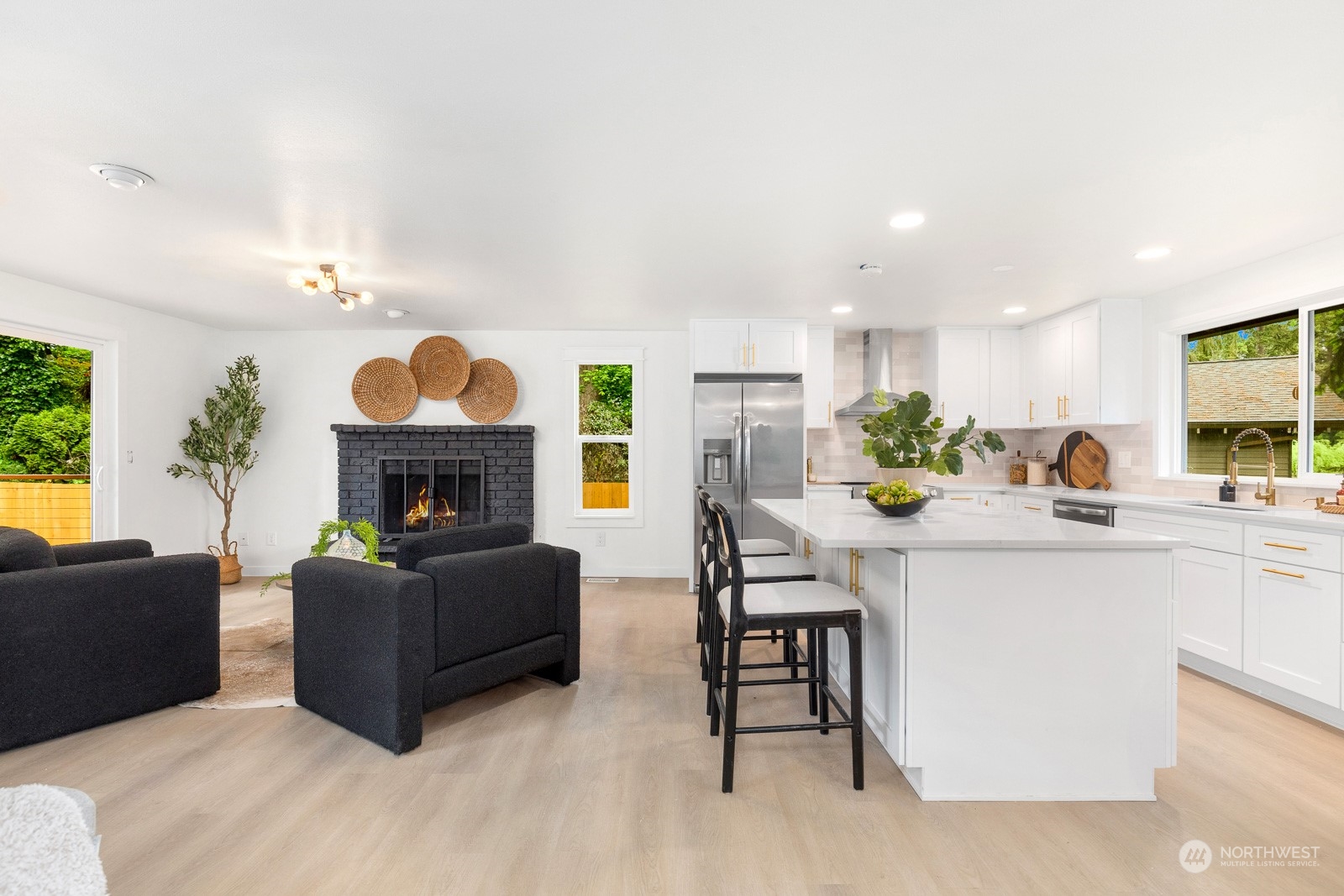212 143rd Street Southeast Everett, WA 98208 - Photo 12 of 40 a living room with furniture a fireplace and a large window