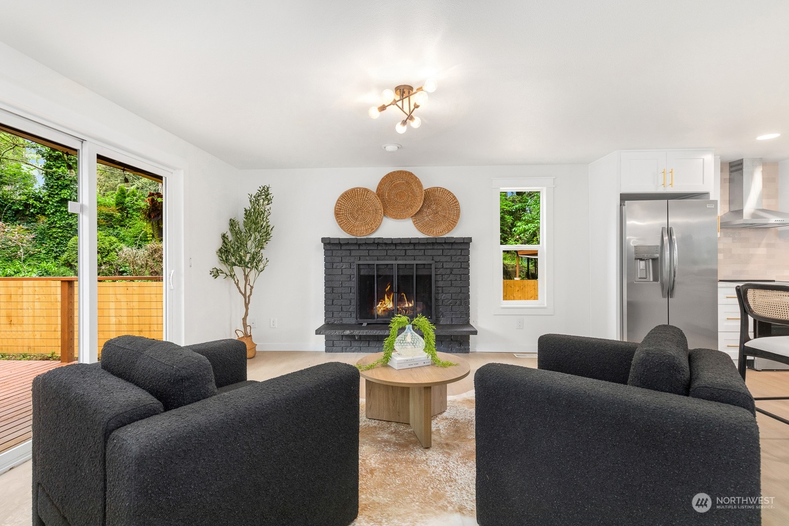 212 143rd Street Southeast Everett, WA 98208 - Photo 13 of 40 a living room with furniture and a fireplace