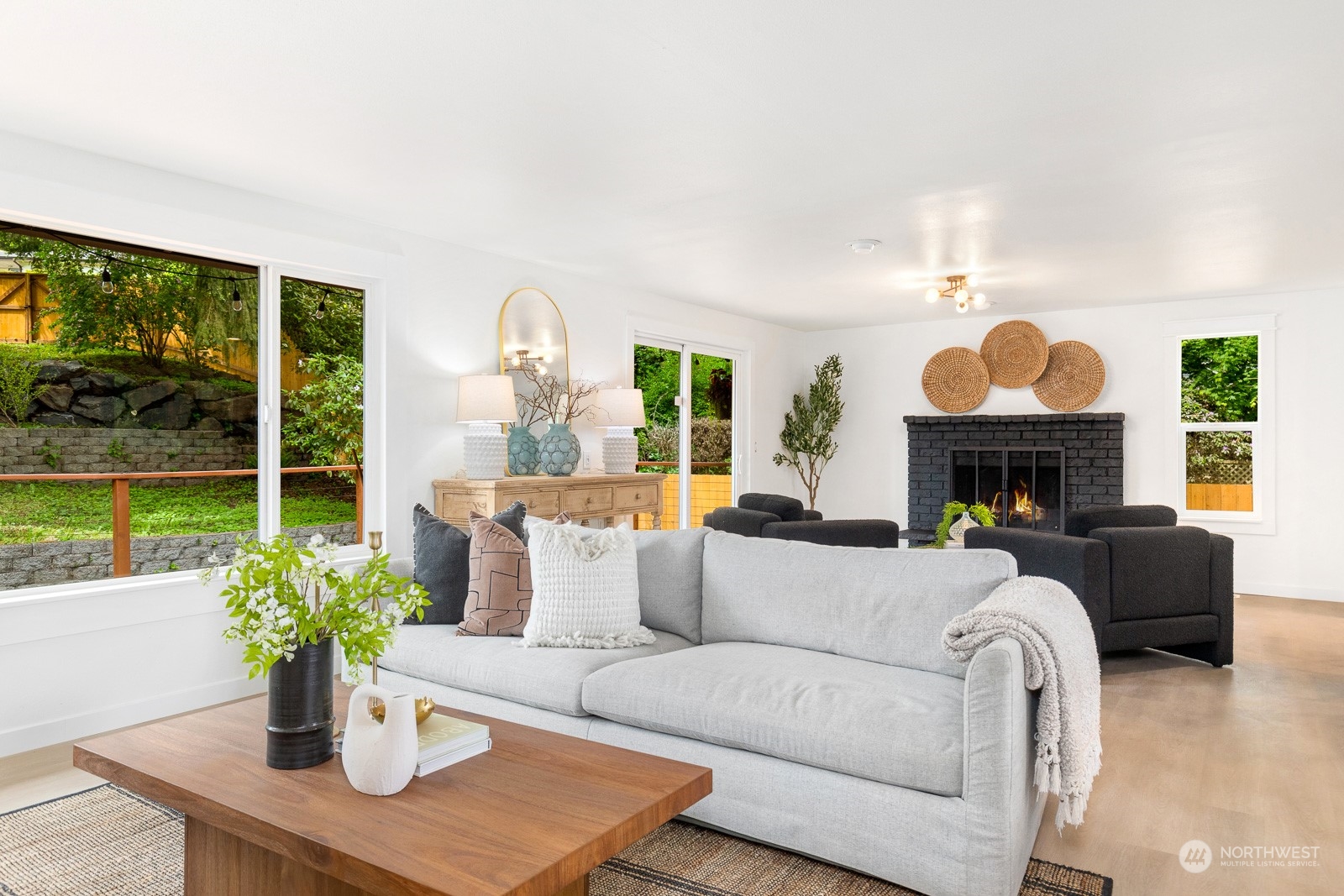 212 143rd Street Southeast Everett, WA 98208 - Photo 15 of 40 a living room with furniture a fireplace and a potted plant