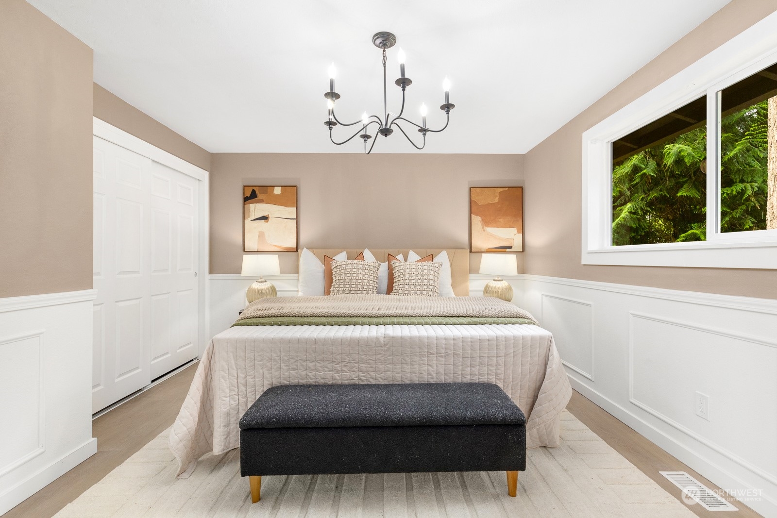 212 143rd Street Southeast Everett, WA 98208 - Photo 17 of 40 a bedroom with a bed and a chandelier