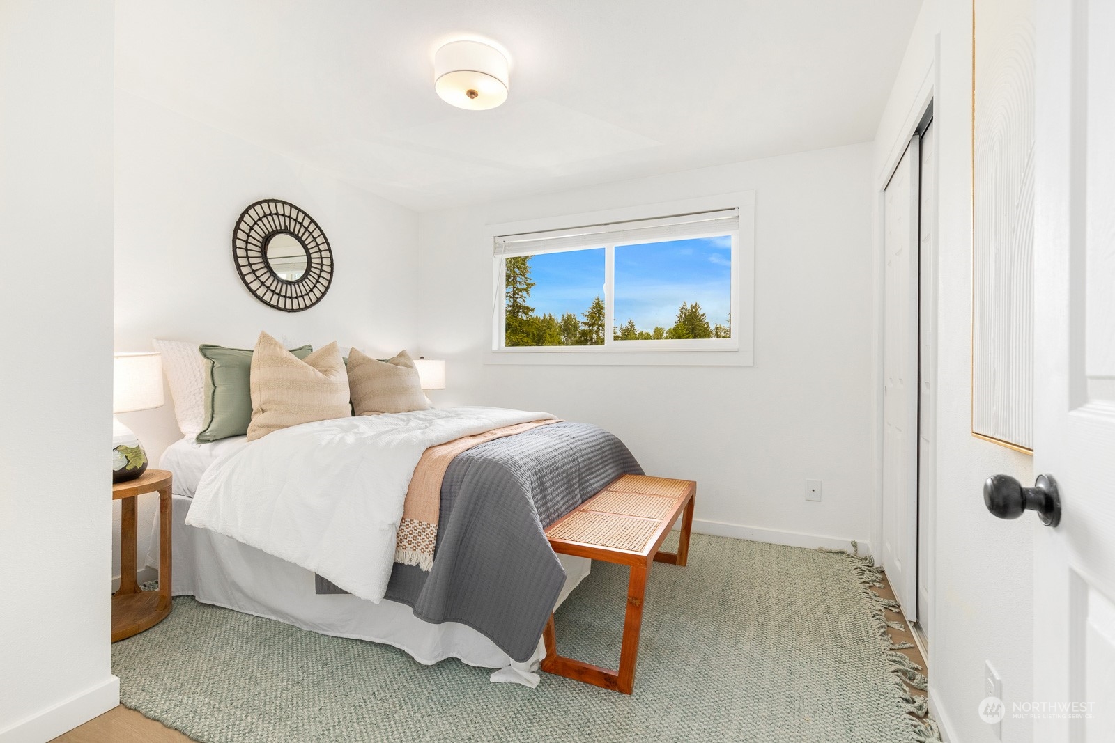 212 143rd Street Southeast Everett, WA 98208 - Photo 22 of 40 a bedroom with a bed and a lamp on dresser