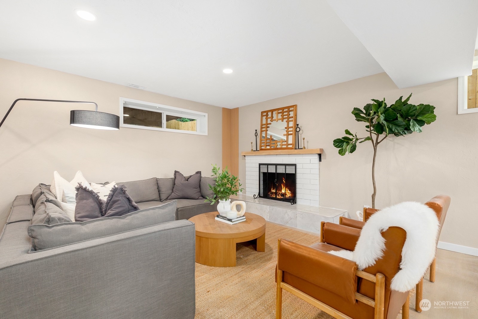 212 143rd Street Southeast Everett, WA 98208 - Photo 25 of 40 a living room with furniture a fireplace and a potted plant