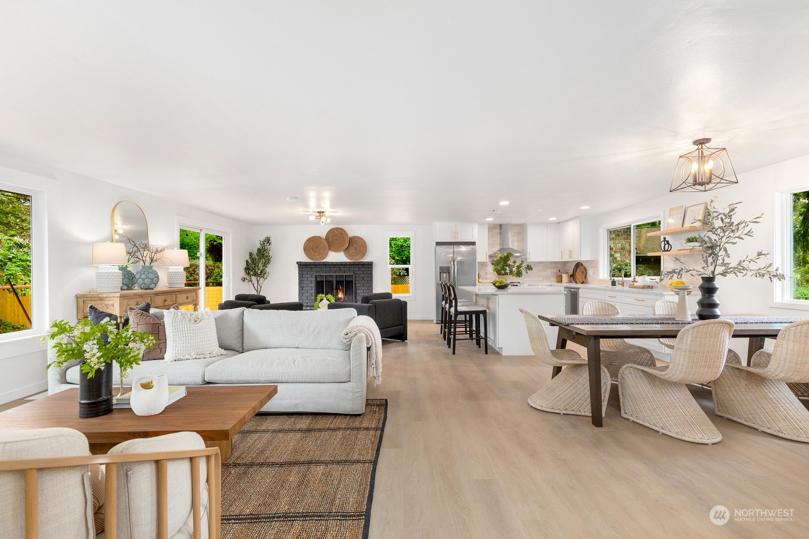 212 143rd Street Southeast Everett, WA 98208 - Photo 5 of 40 a living room with furniture a fireplace and a potted plant