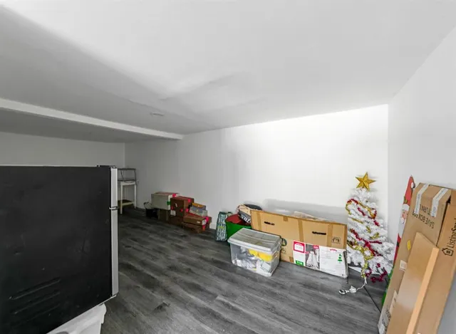 a view of a room with toys and wooden floor