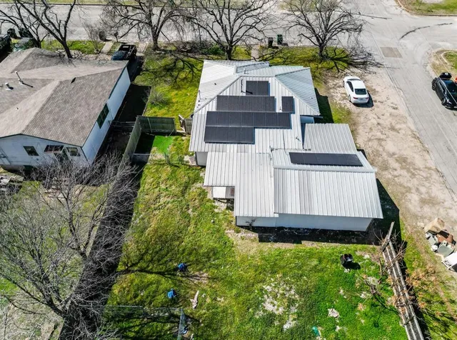 an aerial view of residential house with outdoor space